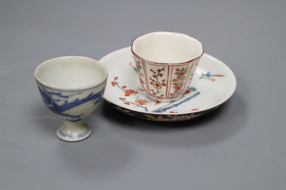 An Arita Dutch decorated saucer, 17th century, a Chinese Dehua Dutch decorated wine cup and a Nanking cargo stem cup